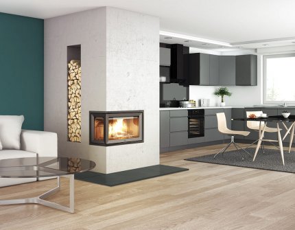 Jøtul I 620 FL white fireplace with a wood niche that divides the room between kitchen and living room
