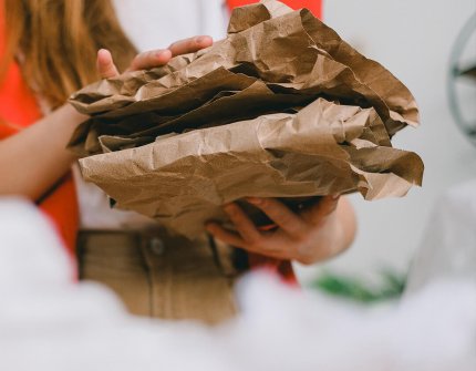 Woman holding cardboard in her hands 